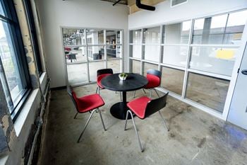 a room with a table and chairs in it